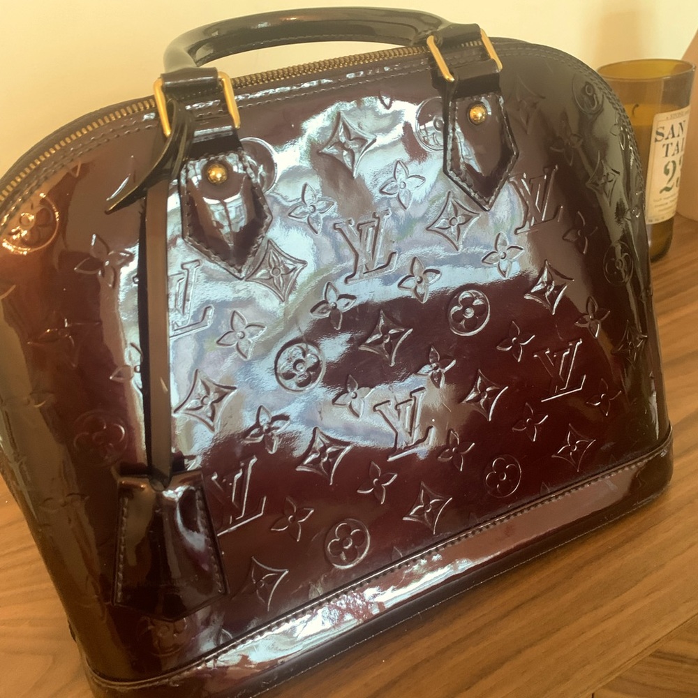 Alma Handbag Monogram Vernis PM